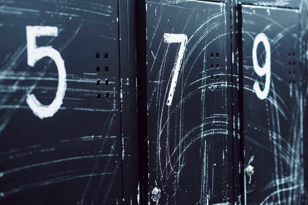 Close-up of numbered lockers in gym