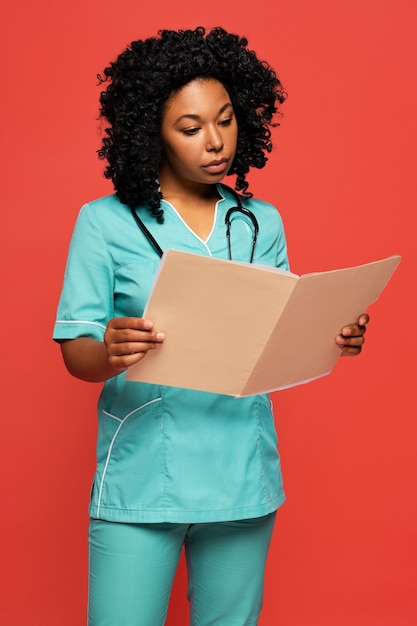 Close up on nurse looking over documents