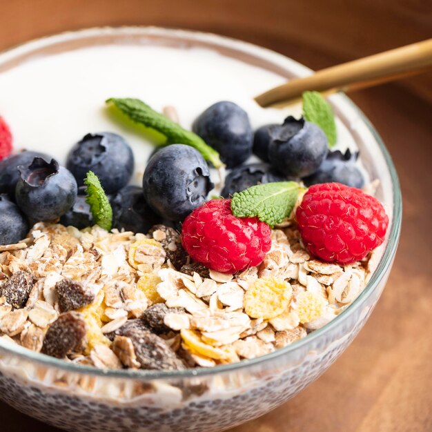 Close-up of oatmeal bowl with raspberries and blueberries