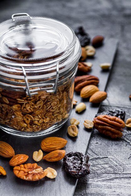 Close up oats jar with dates and nuts mix