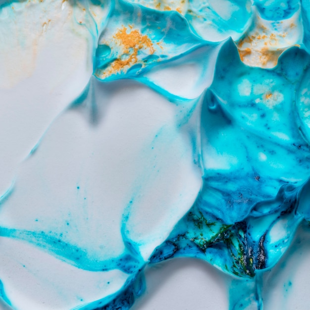 Бесплатное фото Крупный план синей кремовой гладкой текстурированной поверхности