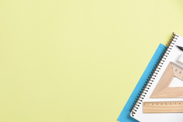 Free Photo close-up of office supplies on yellow background