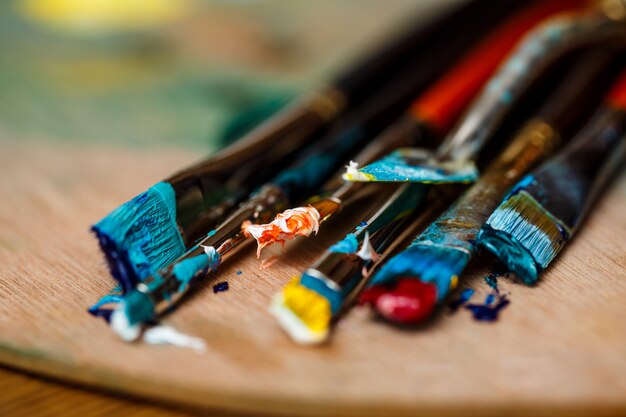 Close up of oil paints and brushes on palette