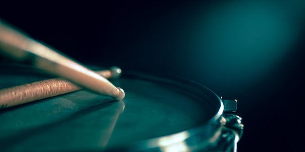 Close up of old retro drum and drumsticks