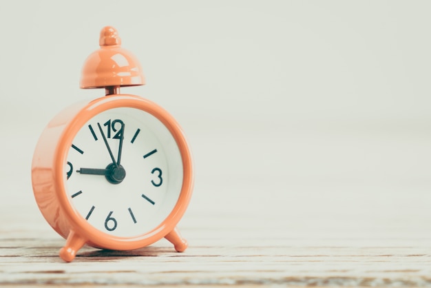 Close-up of orange decorative clock