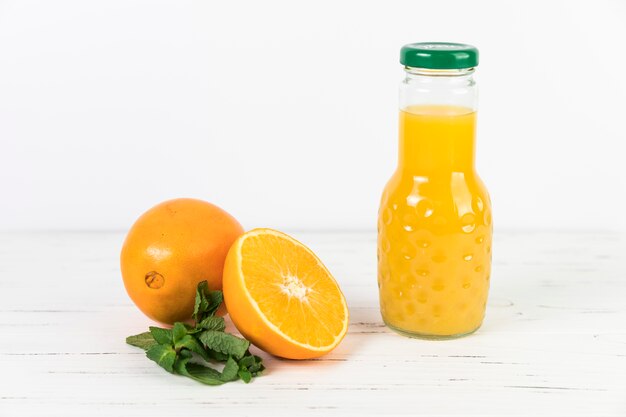 Close up orange juice bottle on table