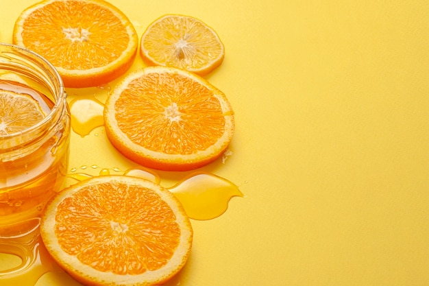 Close-up orange slices with honey
