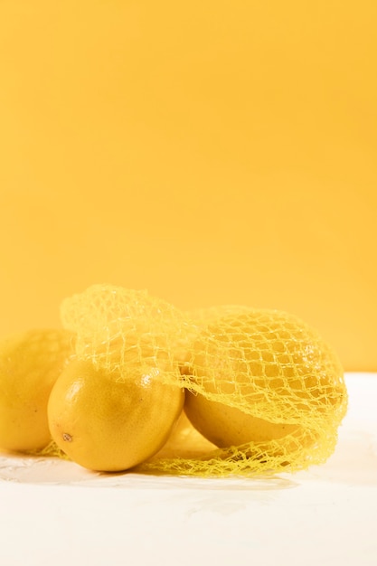 Close-up organic lemons with bag