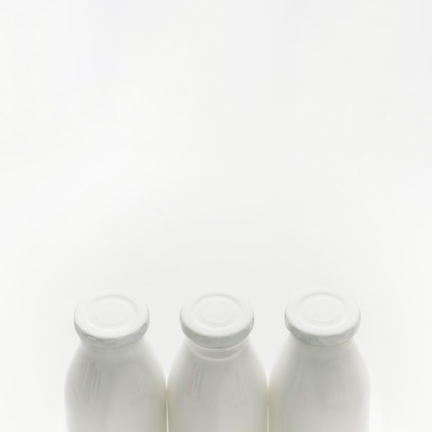 Close-up organic milk bottles with copy space