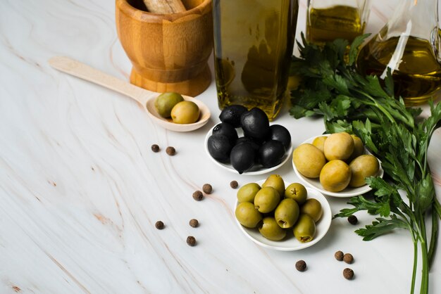 Download Premium Photo High Angle Olive Oil Bottle And Saucer With Yellow Olives And Copy Space PSD Mockup Templates