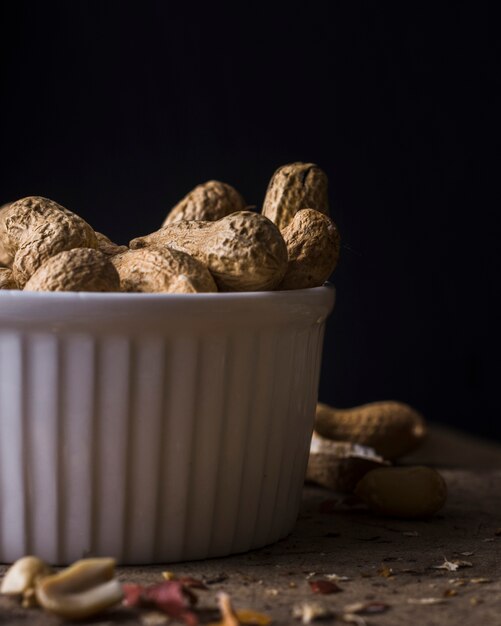 Close-up organic peanuts in a bowl