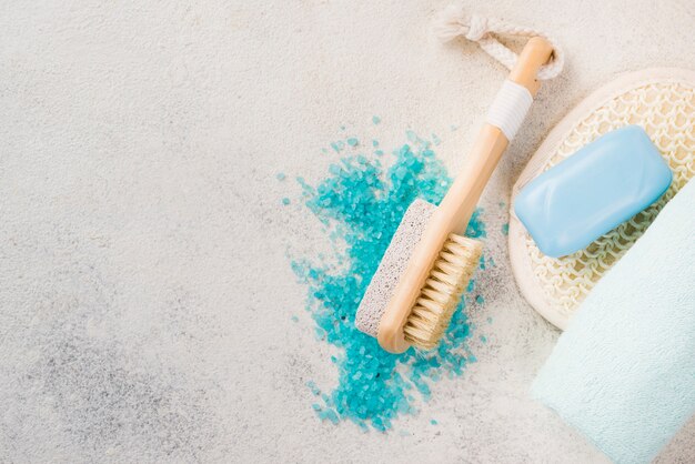 Close-up organic salt and spa brush with towel