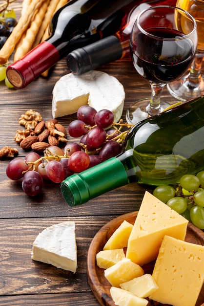 Close-up organic wine and cheese on table