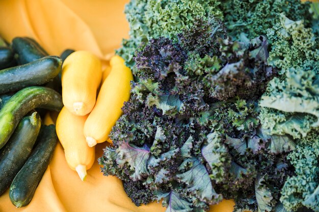 Close-up of organic zucchini and raw kale vegetable