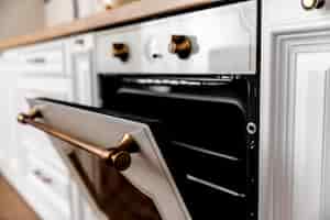 Free photo close-up oven with golden details