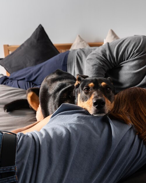 Close up owner holding dog