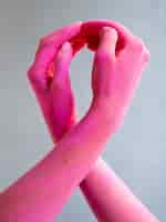 Free photo close-up painted arms expressing cancer awareness