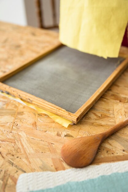 Close-up of paper model on wooden desk