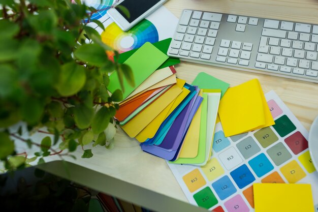 Close-up of parcel tags with sticky notes and keyboard