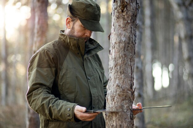 Close up on park ranger in woods