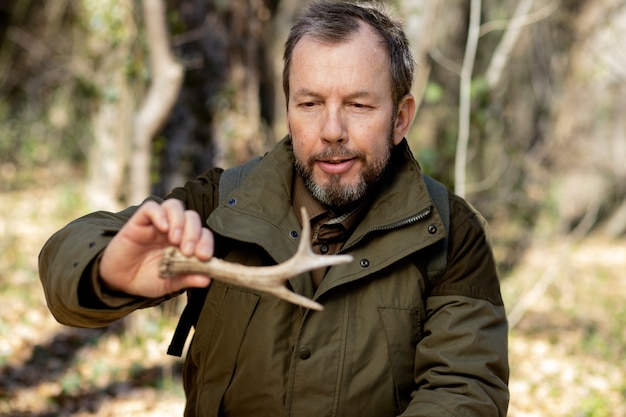 Close up on park ranger in woods