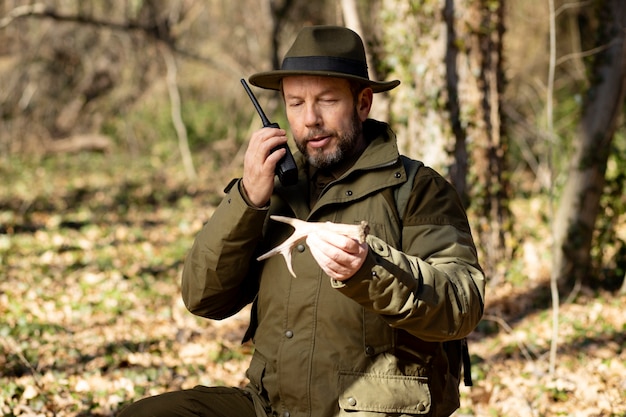 Free photo close up on park ranger in woods