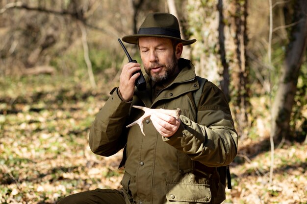 Close up on park ranger in woods