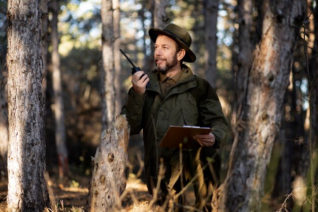 Close up on park ranger in woods