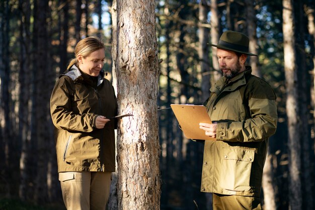 Close up on park rangers in woods