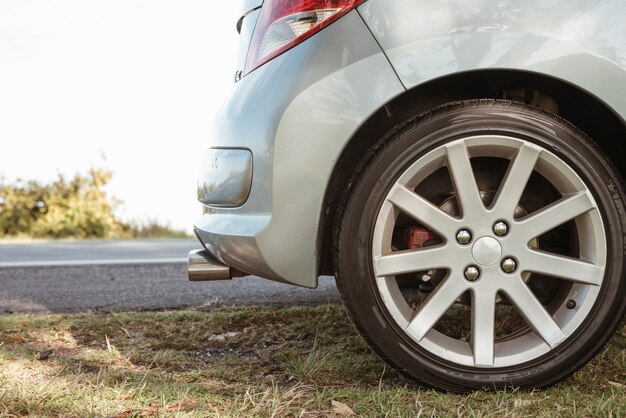 Close up of parked car next to road