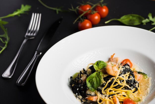 Close-up pasta near utensils