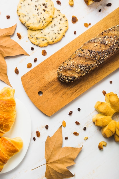 Close-up pastry and leaves near bread