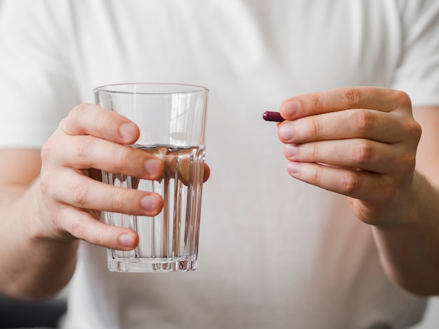 Close-up patient holding pill