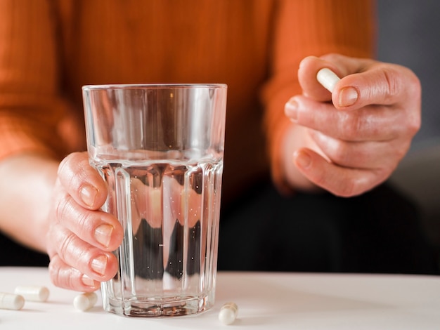 Close-up patient holding pill