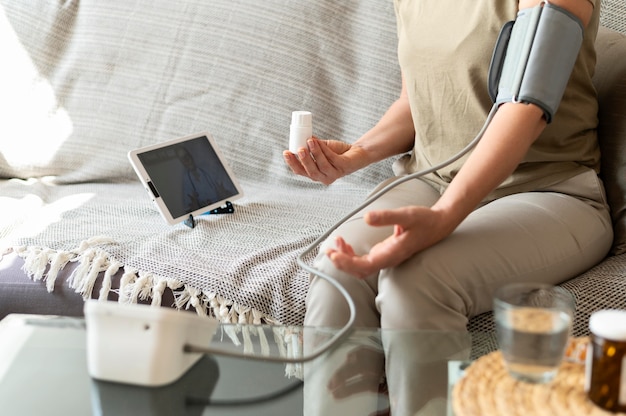 Close up patient monitoring blood pressure