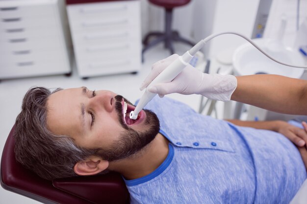 Close-up of patient mouth undergoing dental check up