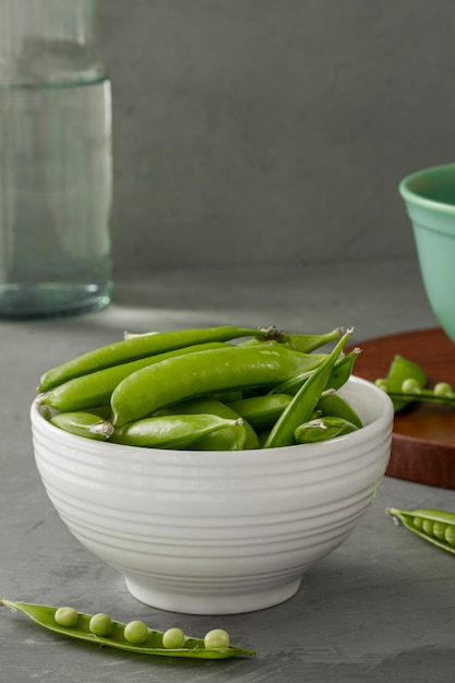 Close-up pea pods in bowl