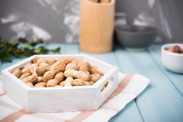 Free photo close-up peanuts on wooden table