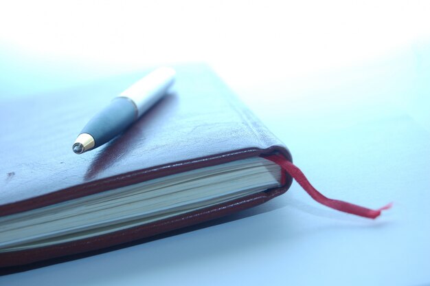 Close-up of pen on an agenda
