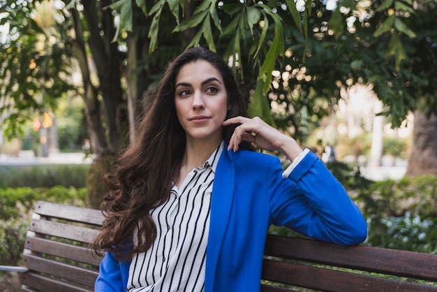 Free photo close-up of pensive businesswoman in the park