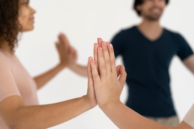 Free photo close up on people connecting through hands