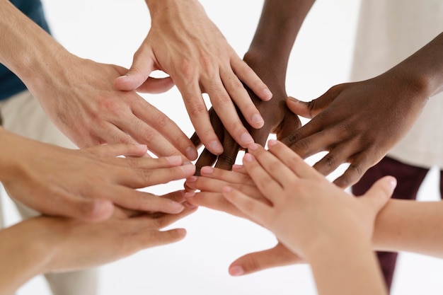 Free photo close up on people connecting through hands