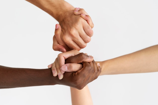 Close up on people connecting through hands