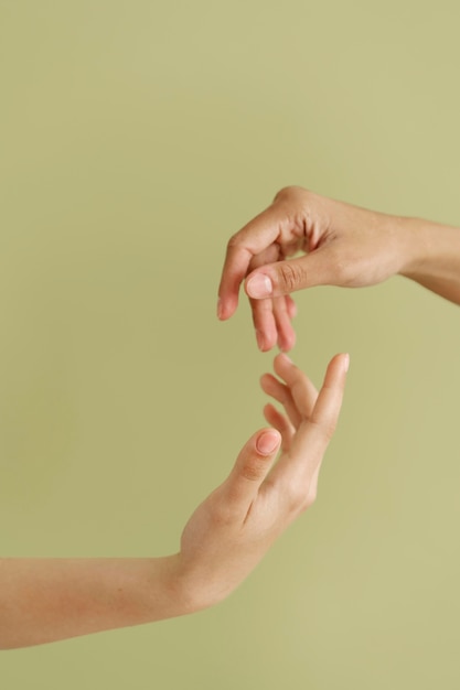 Close up on people connecting through hands