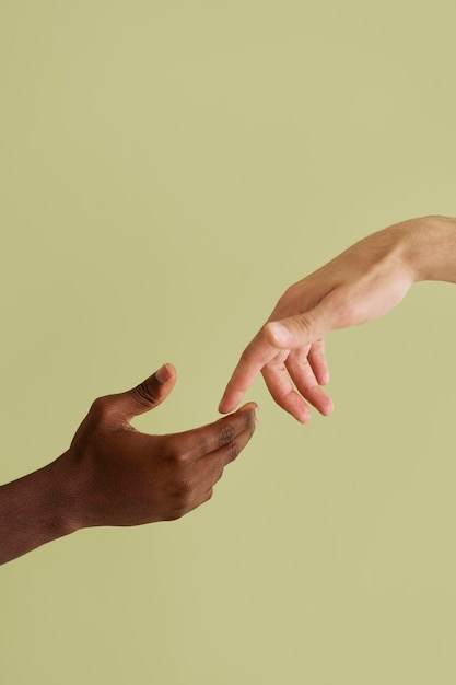 Close up on people connecting through hands