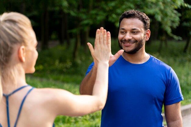 Close up people high five