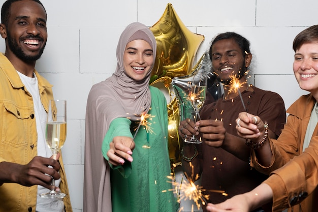 Free photo close up people holding fireworks