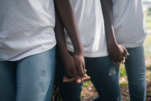 close up people holding hands