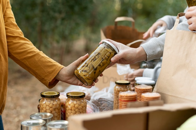 Close up people holding jar