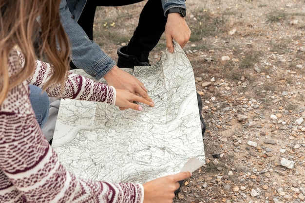 Free photo close up people holding map